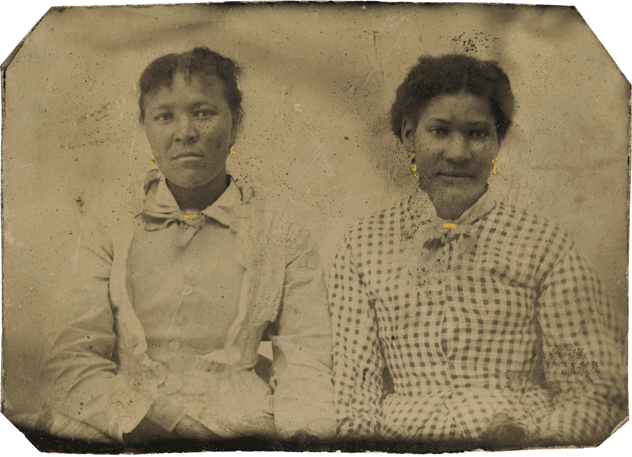 Tintype of two women wearing gold-painted earrings and kerchief pins.