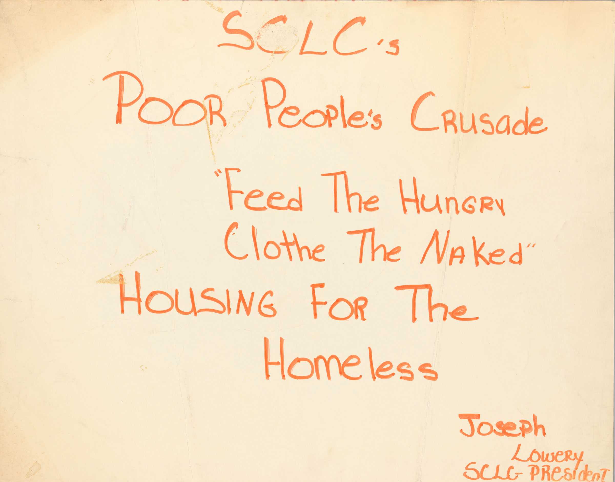 A Southern Christian Leadership Council handmade poster with orange ink on white poster board. The poster is about homelessness.