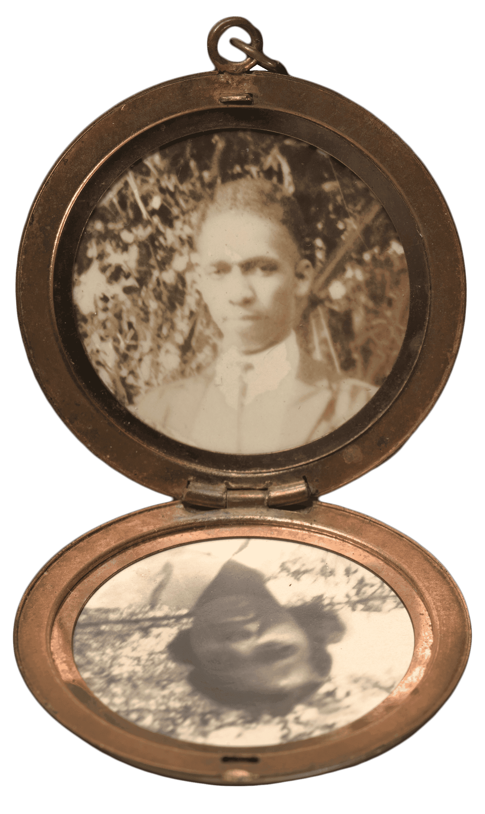 Gold locket with floral engravings with black-and-white photos of Harriette Vyda Simms Moore and Harry Tyson Moore, framed by copper-colored rings.