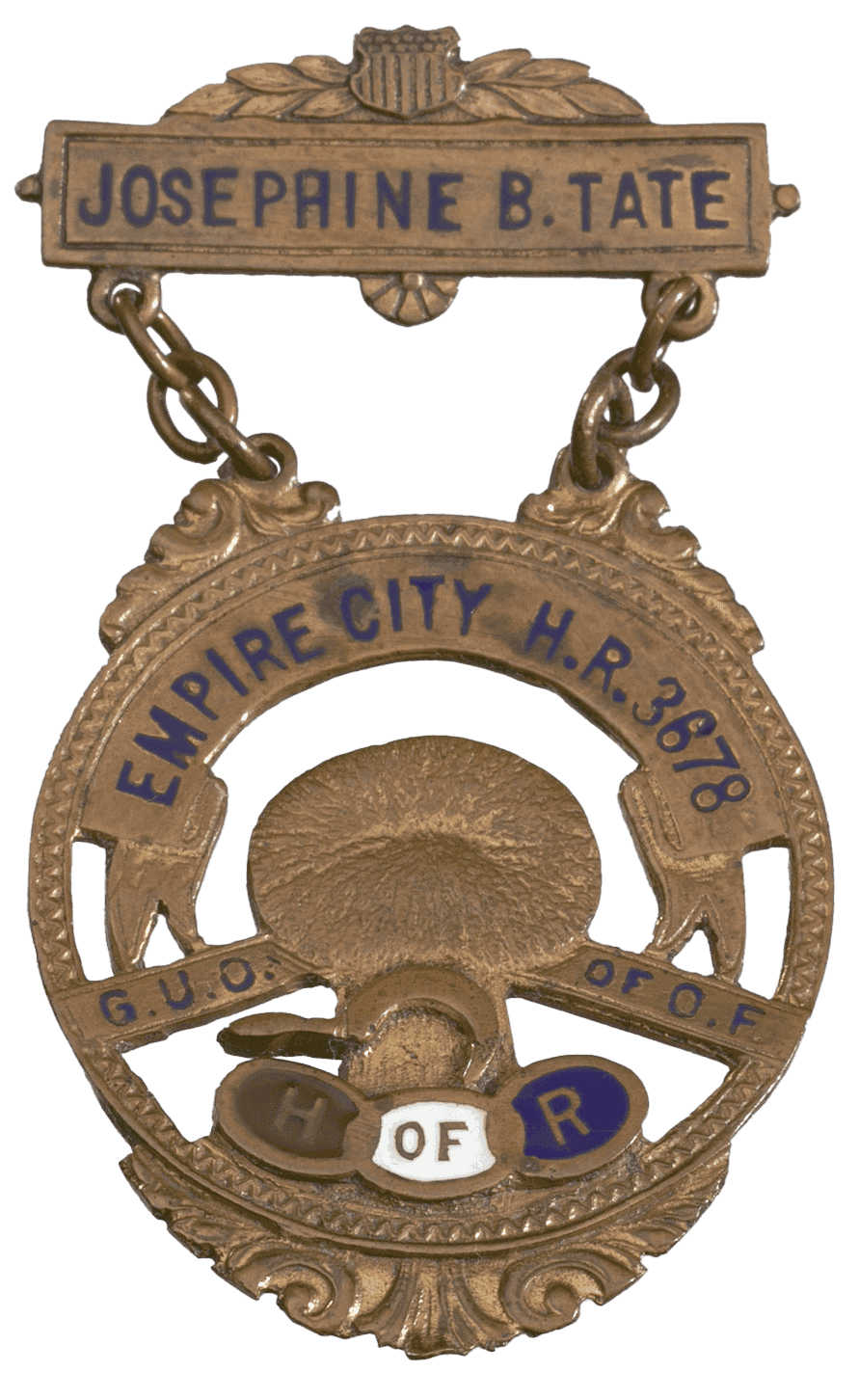 A gold medal with the words: JOSEPHINE B. TATE suspended above a circular medallion with the words.