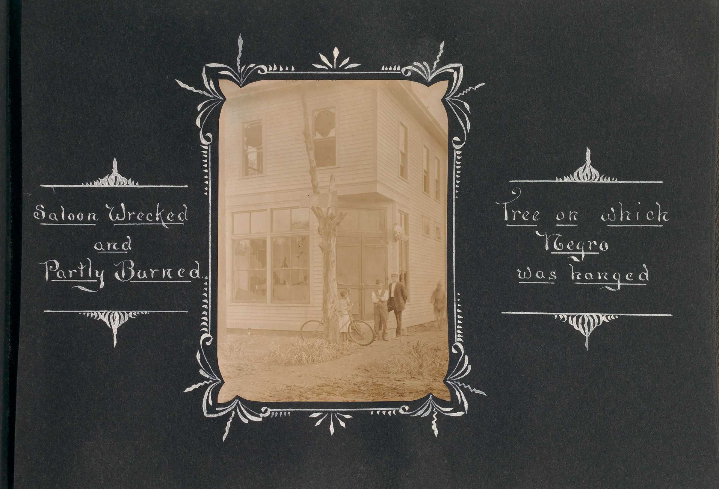 Black photograph with sepia-toned photo of a tree of Springfield Illinois race riot aftermath with hand-drawn captions.