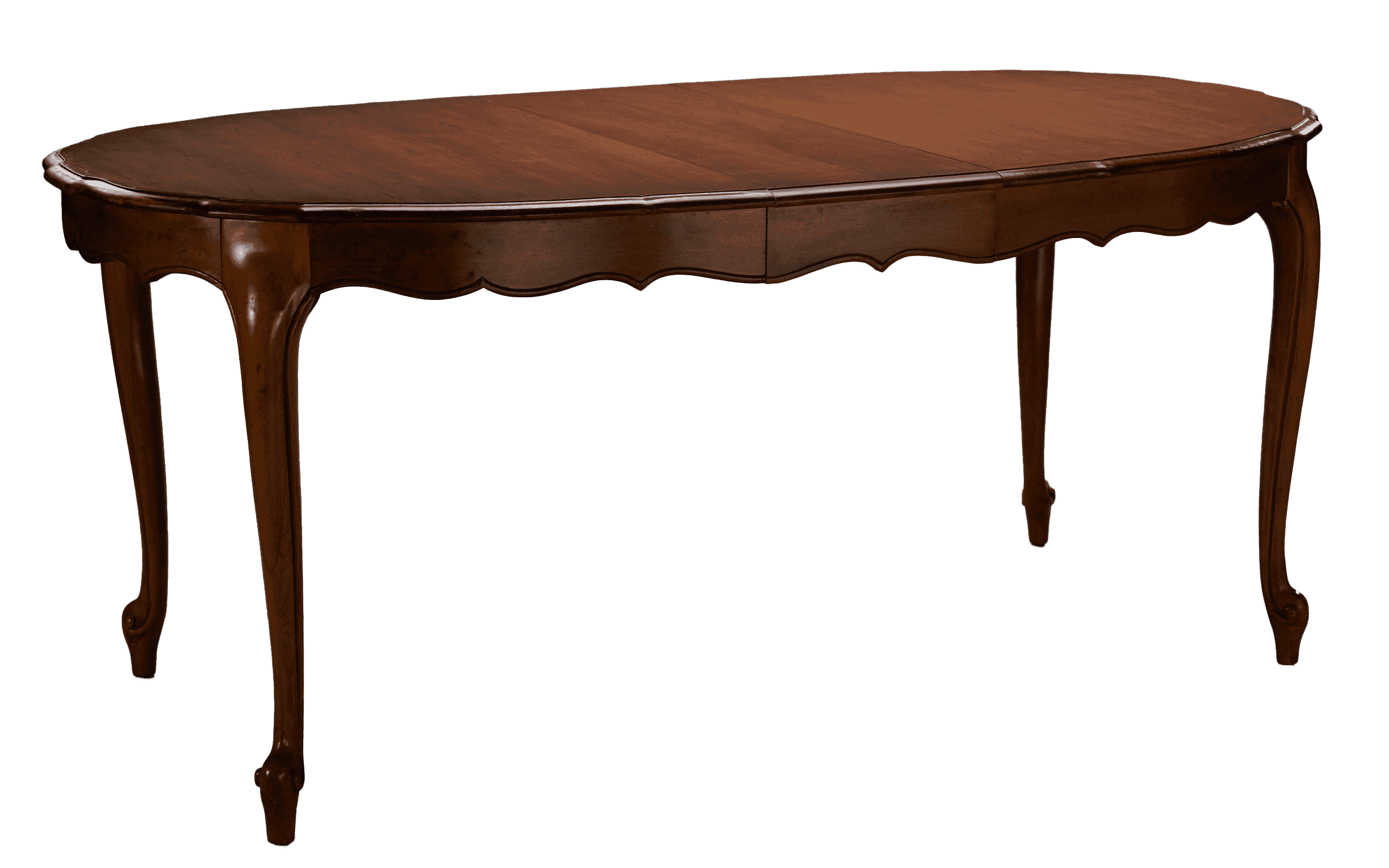 An oval-shaped dark wood dining room table with cabriole legs ending in whorl feet. 