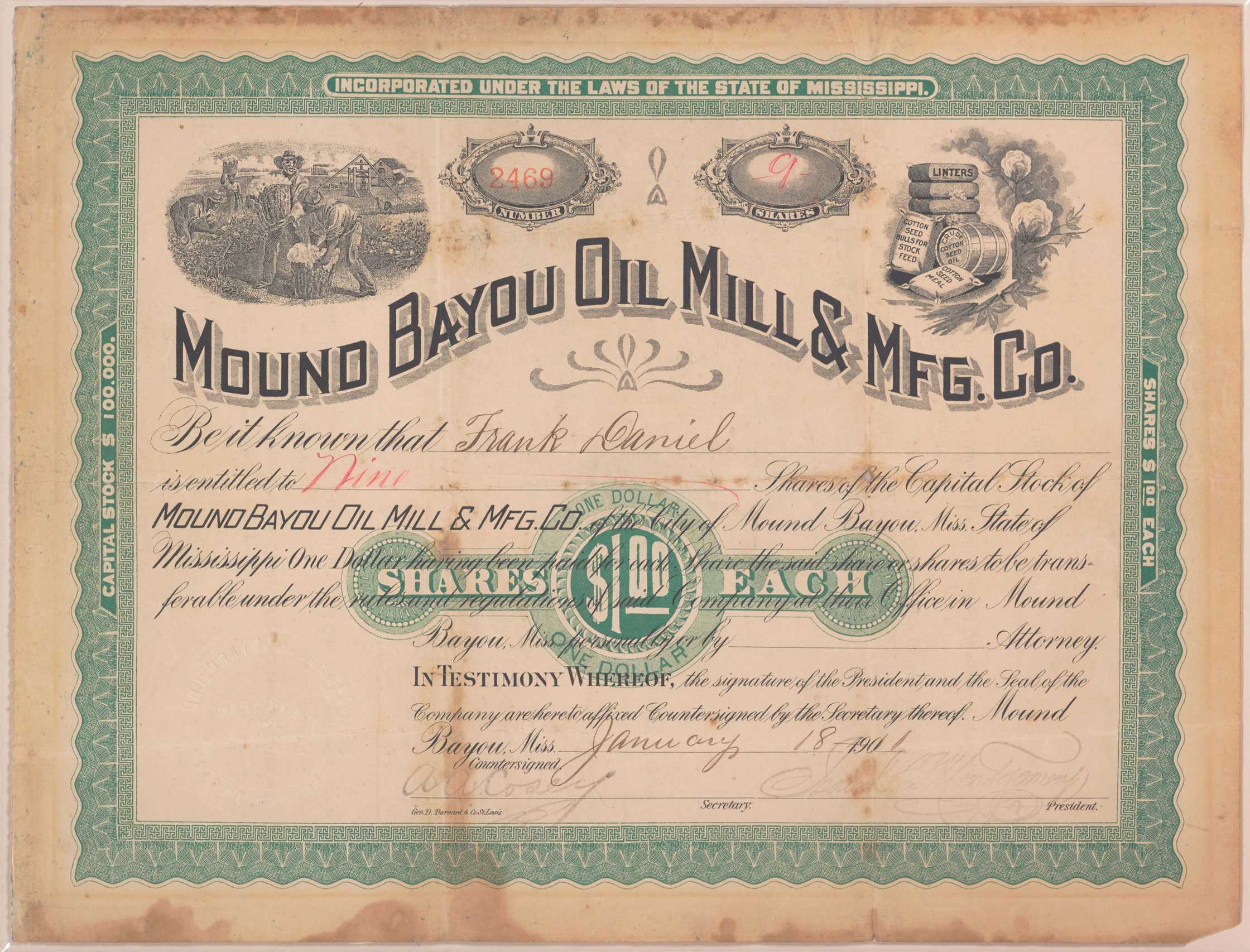 A stock certificate for shares. The certificate is on cream colored paper surrounded by an elaborate green border.