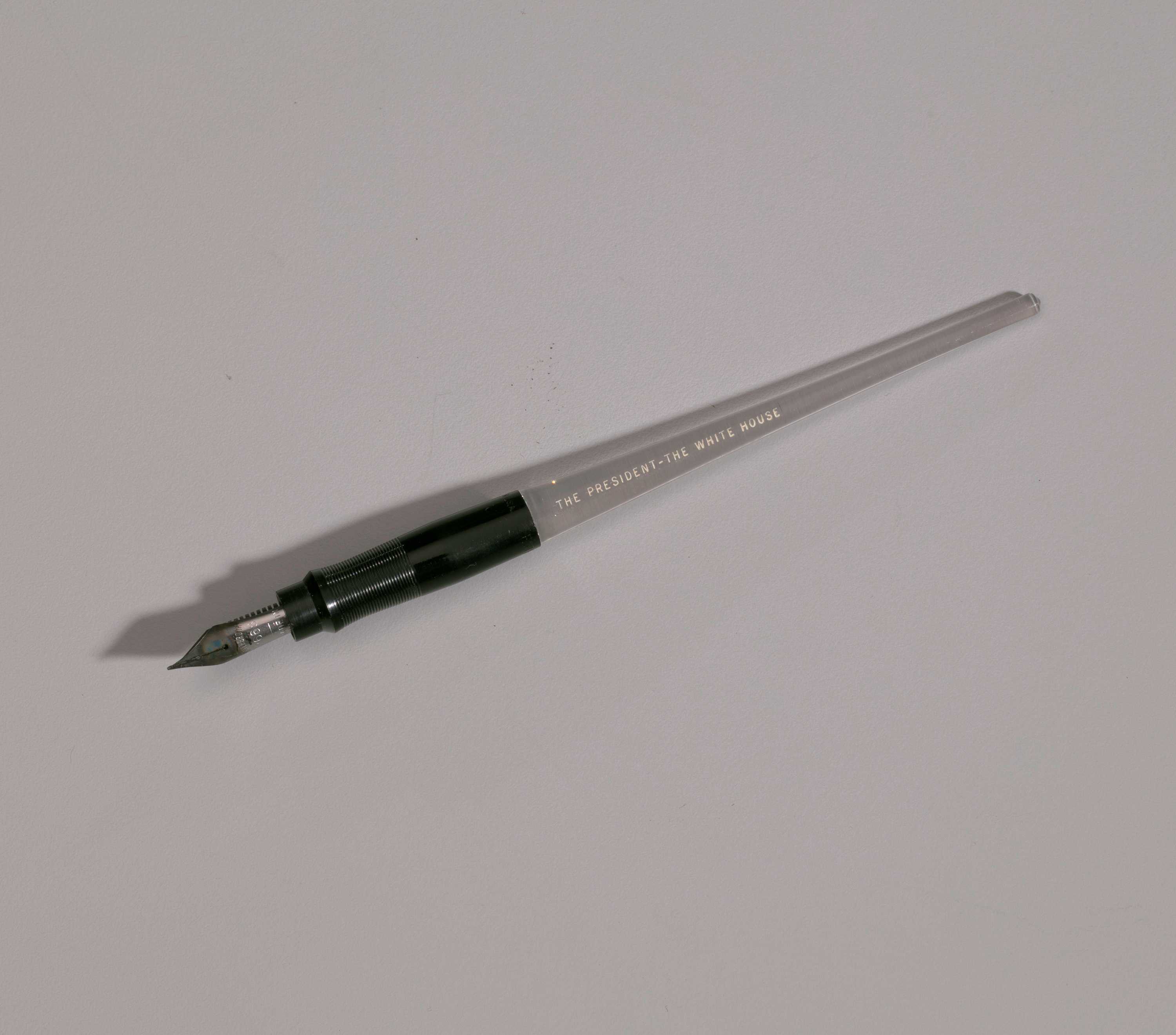 An Esterbrook pen with black plastic grip and "The President - The White House" printed in white ink.