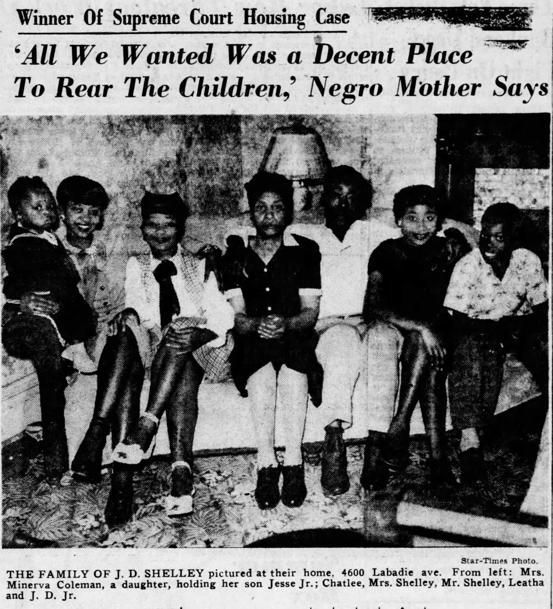 Newspaper clipping titled "Winner of Supreme Court House Case"   "All We Wanted Was a Decent Place To Rear The Children, " Negro Mother Says." Below the headline  is a black and white photograph of a Black family seated on a couch.  There are 5 children surrounding their parents.