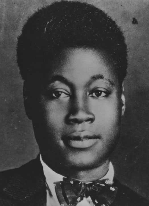 Black and white portrait of an African American man wearing a bow tie.