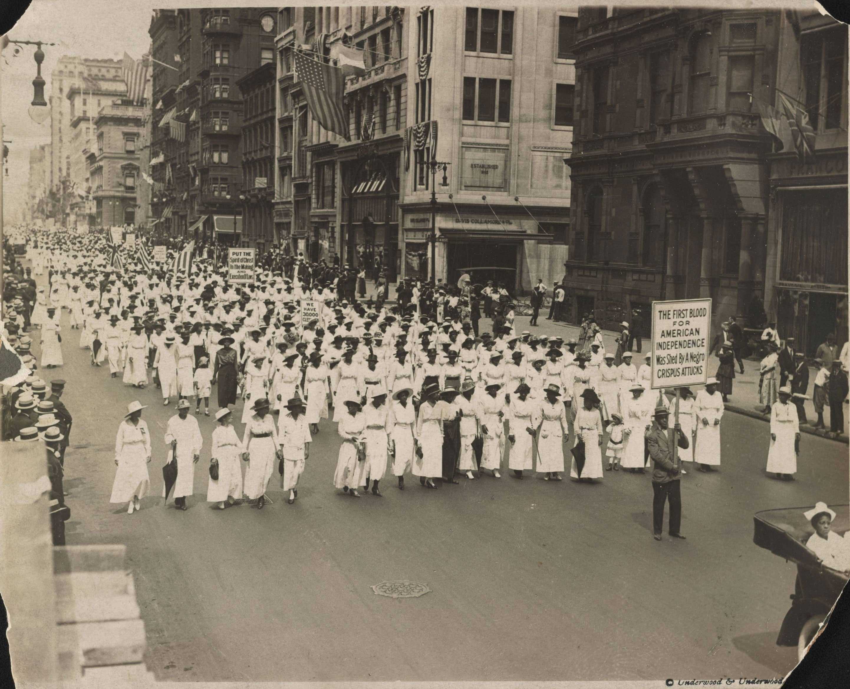 Silent protesters filled the streets in New York. The hundreds of people are all dressed in white walking side by side.