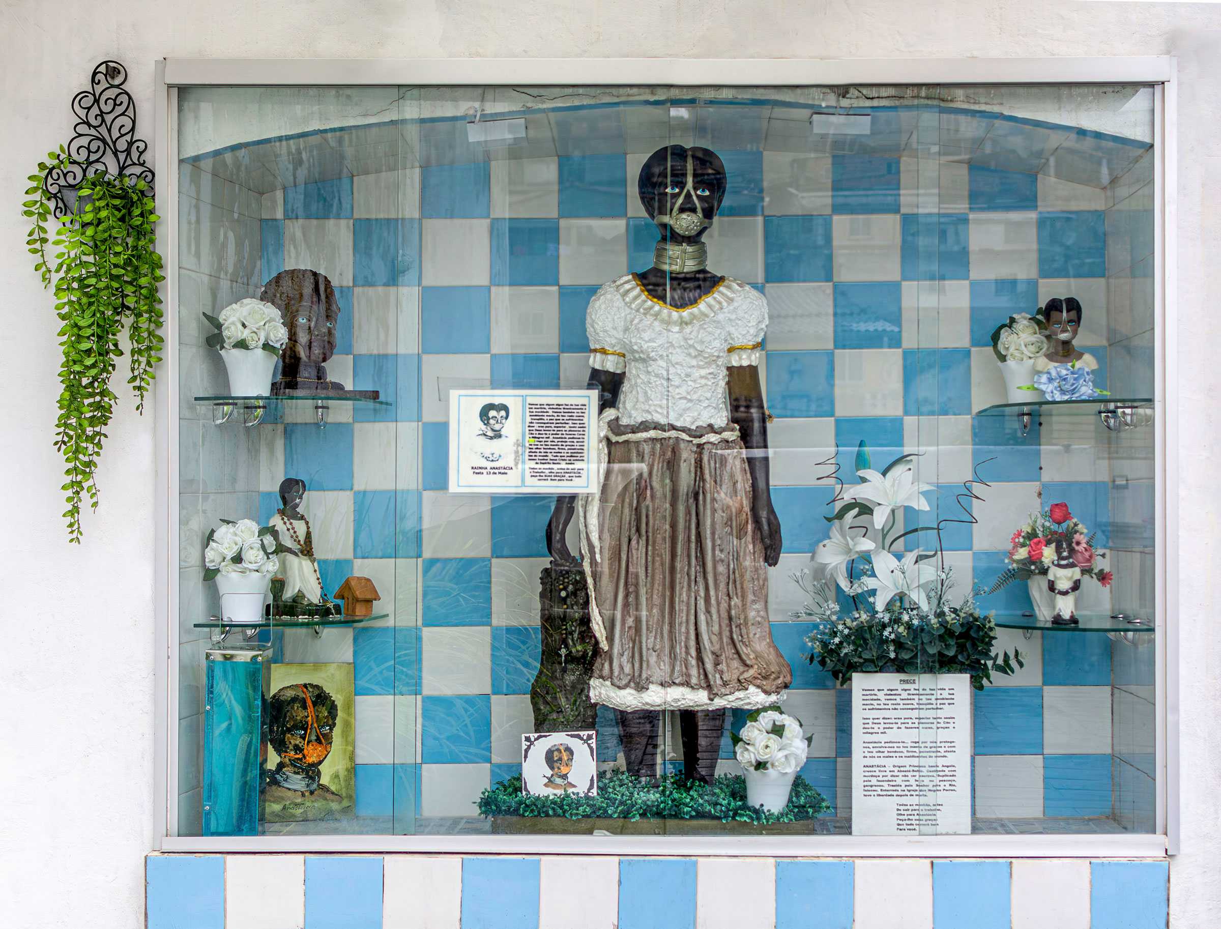 Window display that is set up like an altar to the Slave Anastasia. One large scupluture of Slave Anastasia is in the center.