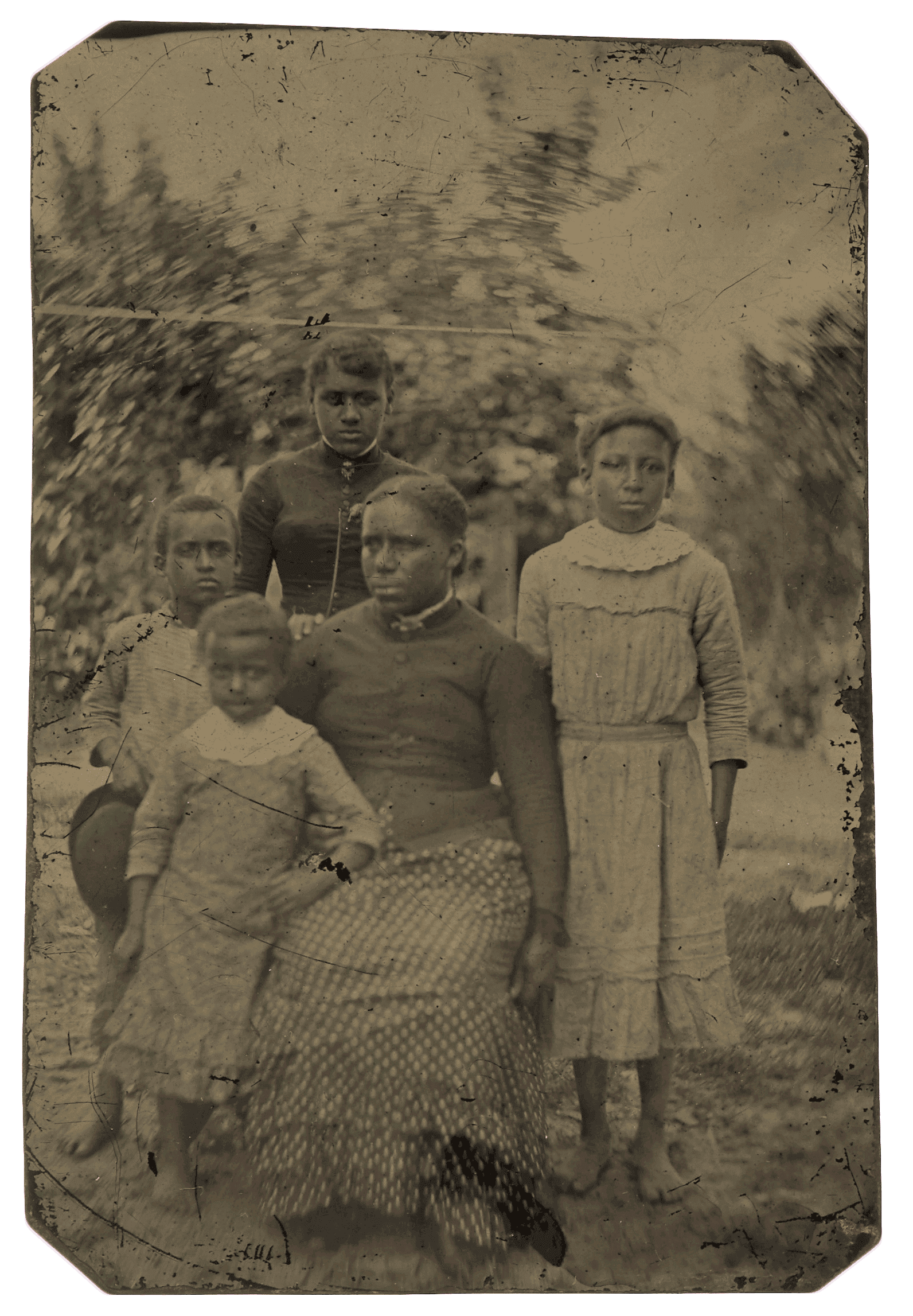 Tintype of a woman seated outside with three girls and one boy standing next to her.