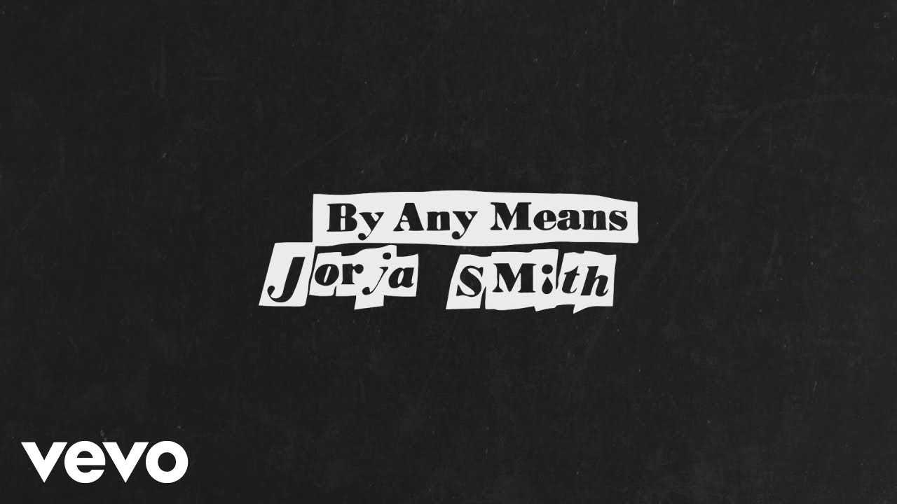 Youtube cover of Jorja Smith, “By Any Means”. Against a black background, the title is in collaged white lettering.