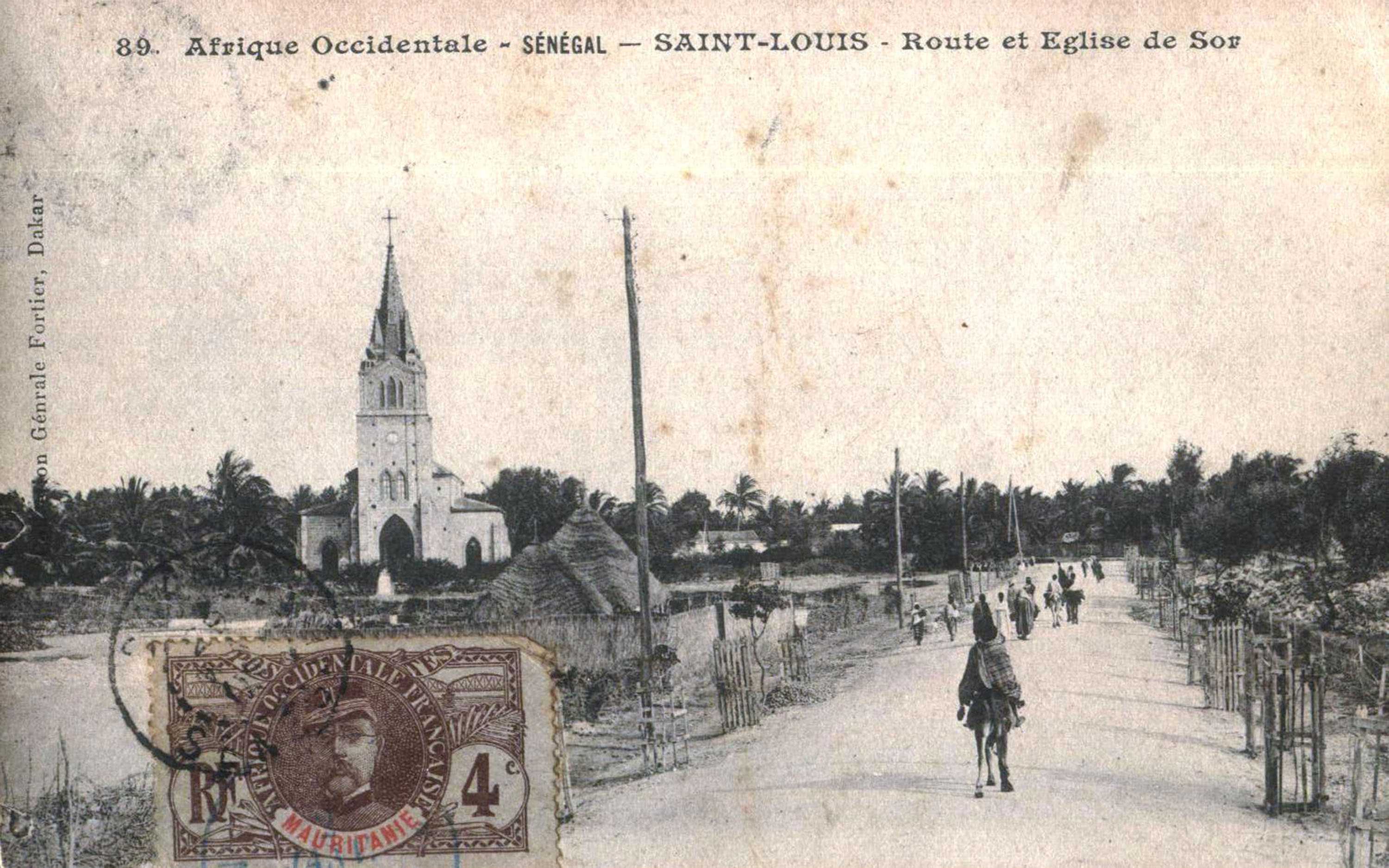 A black and white photograph postcard of Senegal. A brown French stamp is on the left bottom.