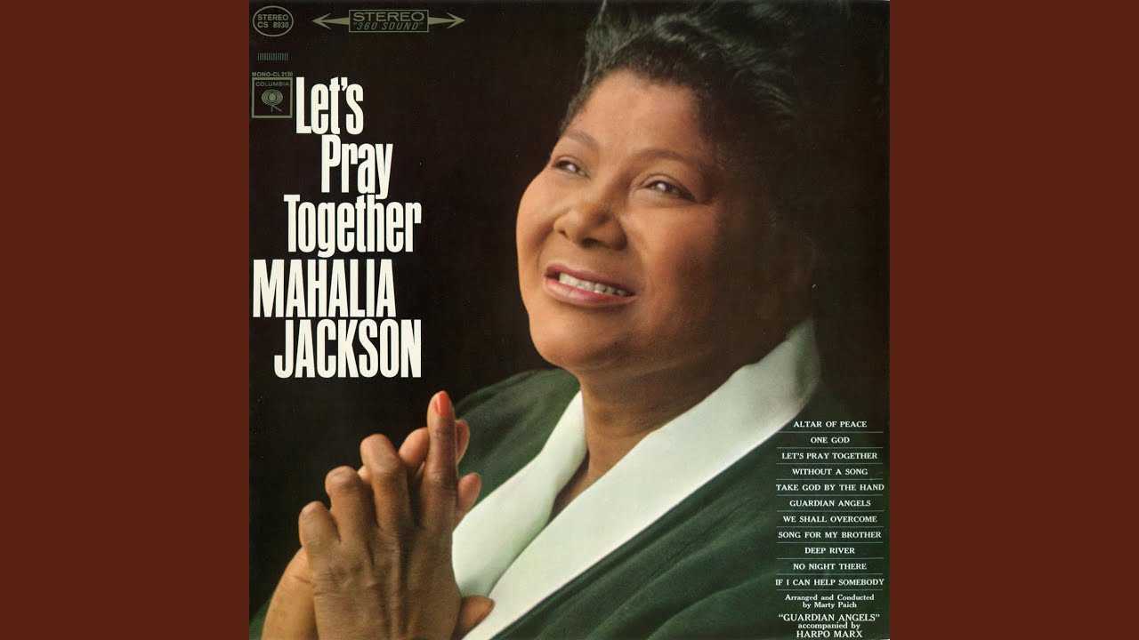 The album cover of Mahalia Jackson, “We Shall Overcome". Jackson is smiling with her hands clasp.