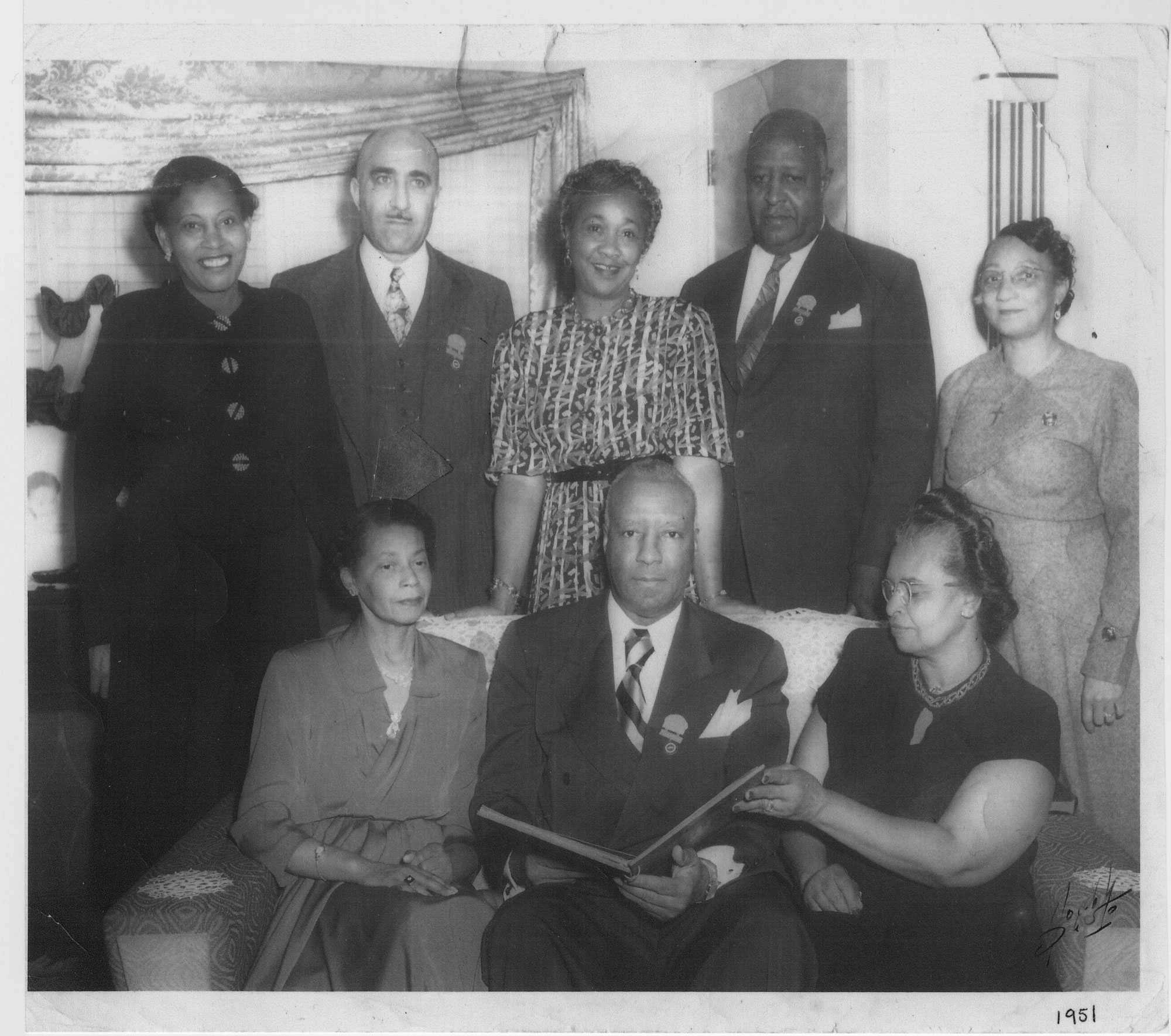 A black and white photograph of the leaders of The Brotherhood of Sleeping Car Porters and the Ladies Auxiliary to the Brotherhood of Sleeping Car Porters.