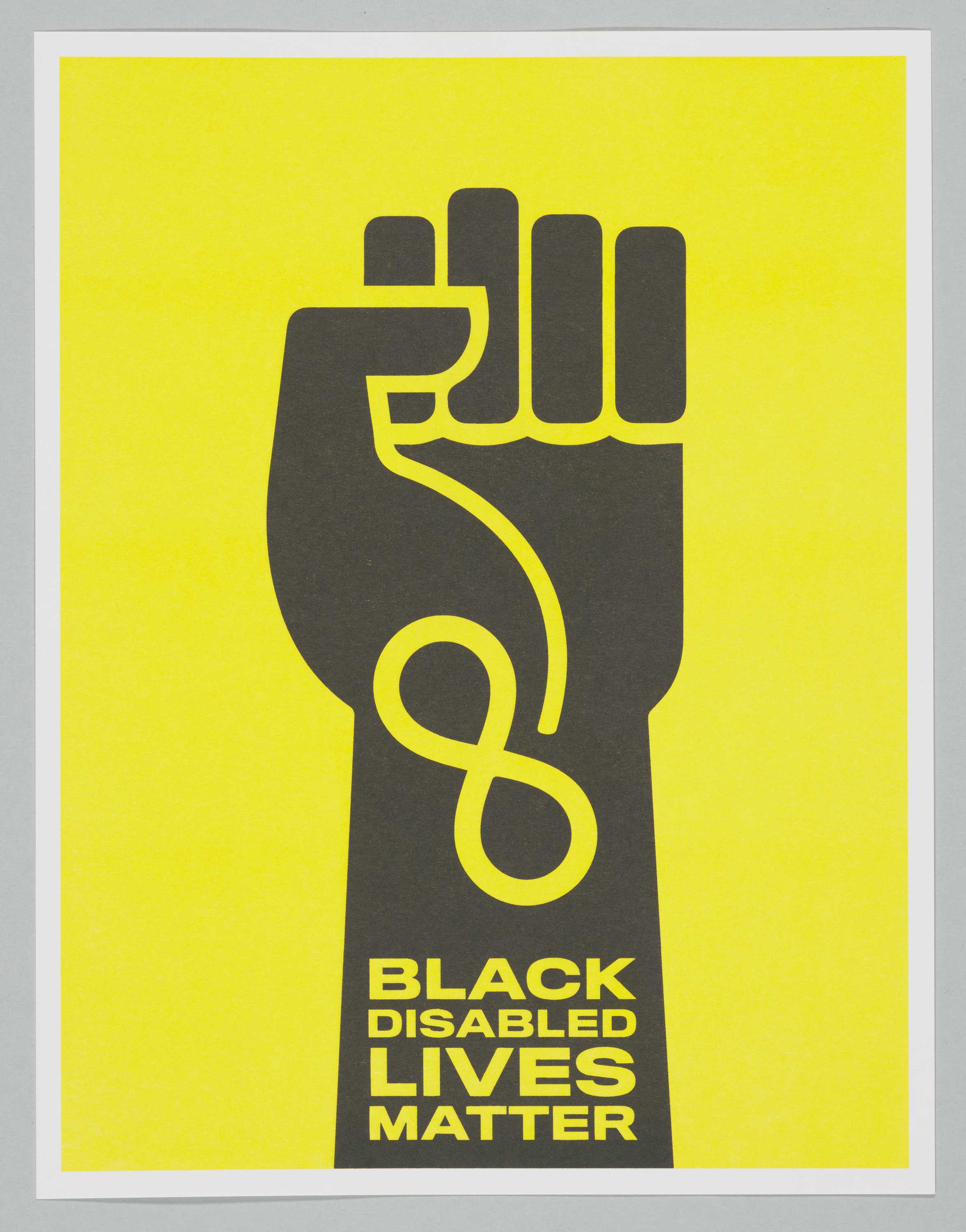 Poster with bright yellow backround and black fist with "BLACK DISABLED LIVES MATTER' written on the base of the fist.