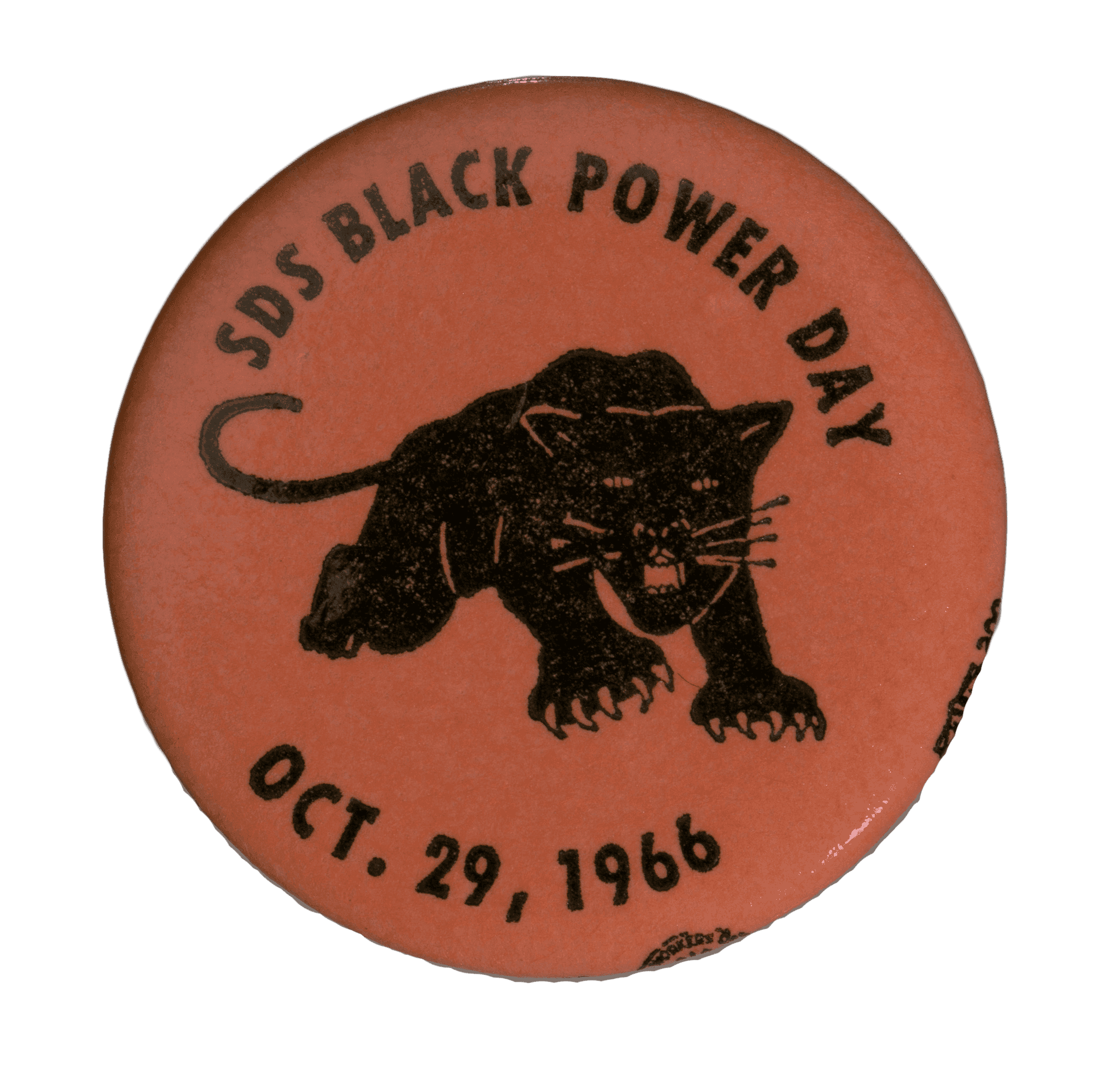 A SDS Black Power Day Button dated Oct.29, 1966. The orange button has the logo of the Black Panthers in the middle.