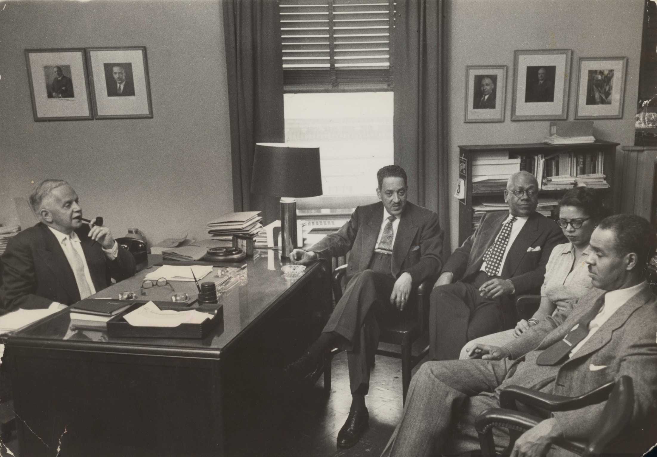 Black and white photograph of NAACP staff member meeting including Thurgood Marshall.