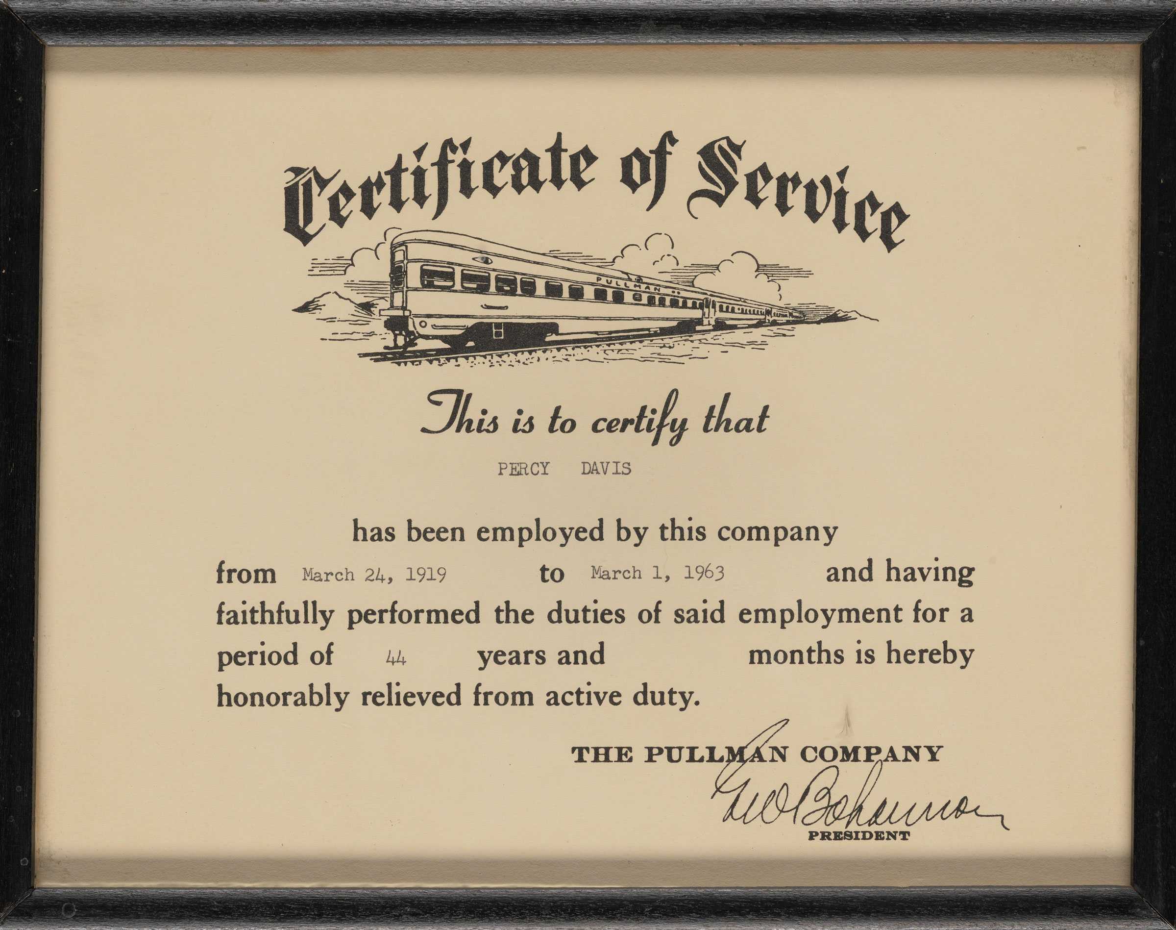 A printed certificate of service given to Percy Davis from the Pullman Palace Car Company in a wood frame. An image of a train is at the top of the certificate.