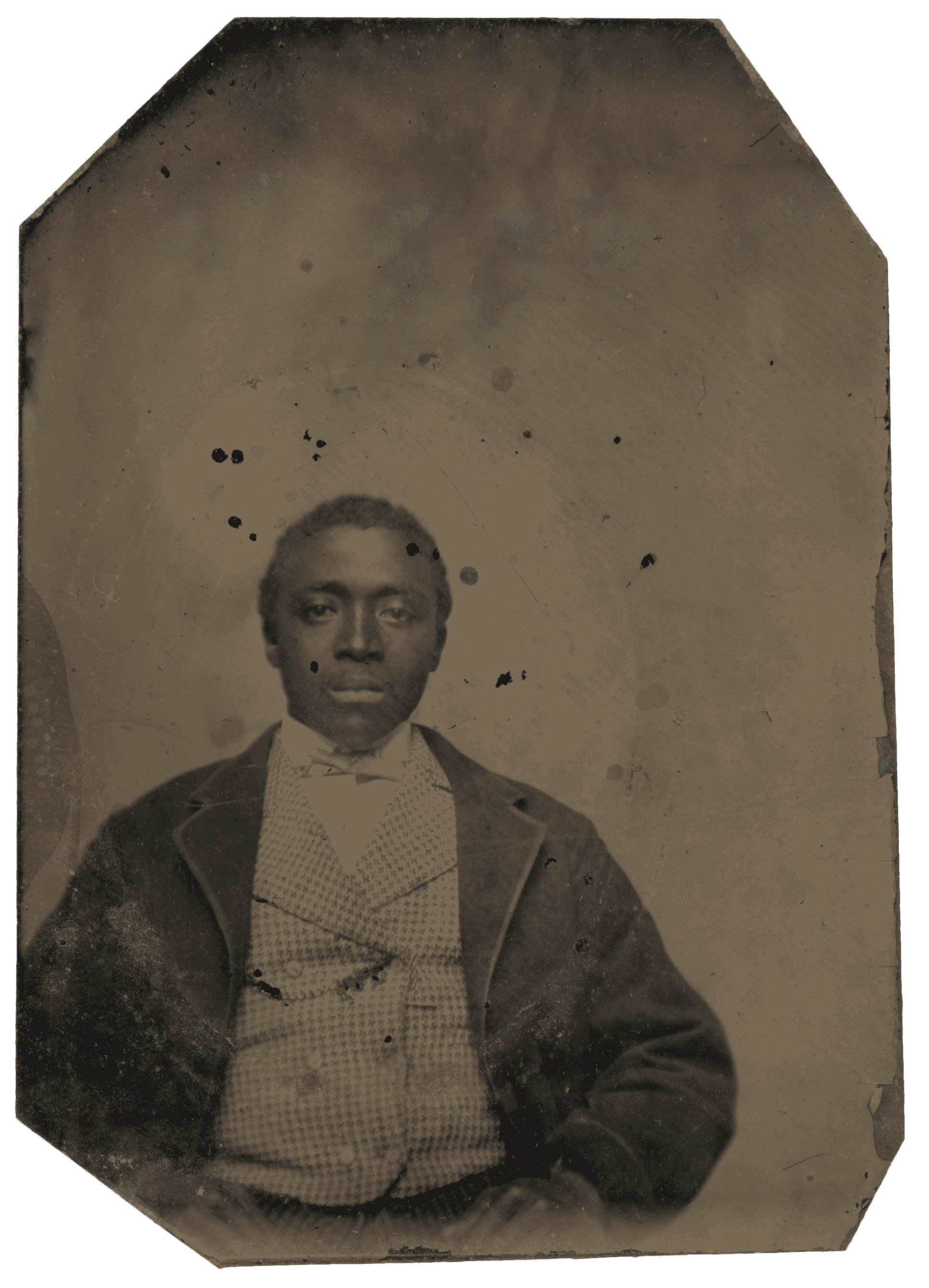 A tintype of an unidentified African American wearing a jacket, double-breasted waistcoat, and tie.