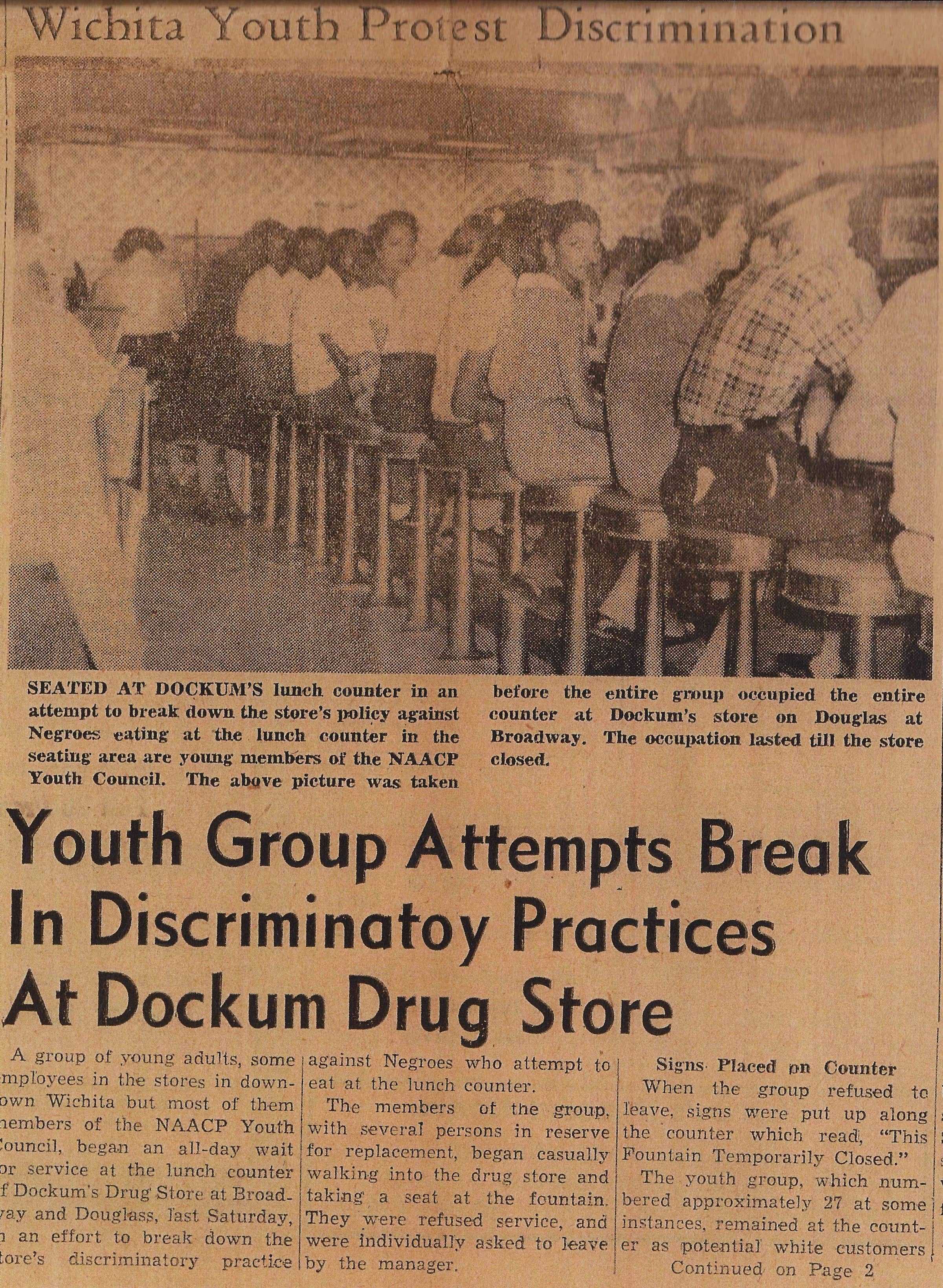 A newspaper clipping of an article and faded photograph about a student sit-in at Dockum Drugstore in Wichita, Kansas.