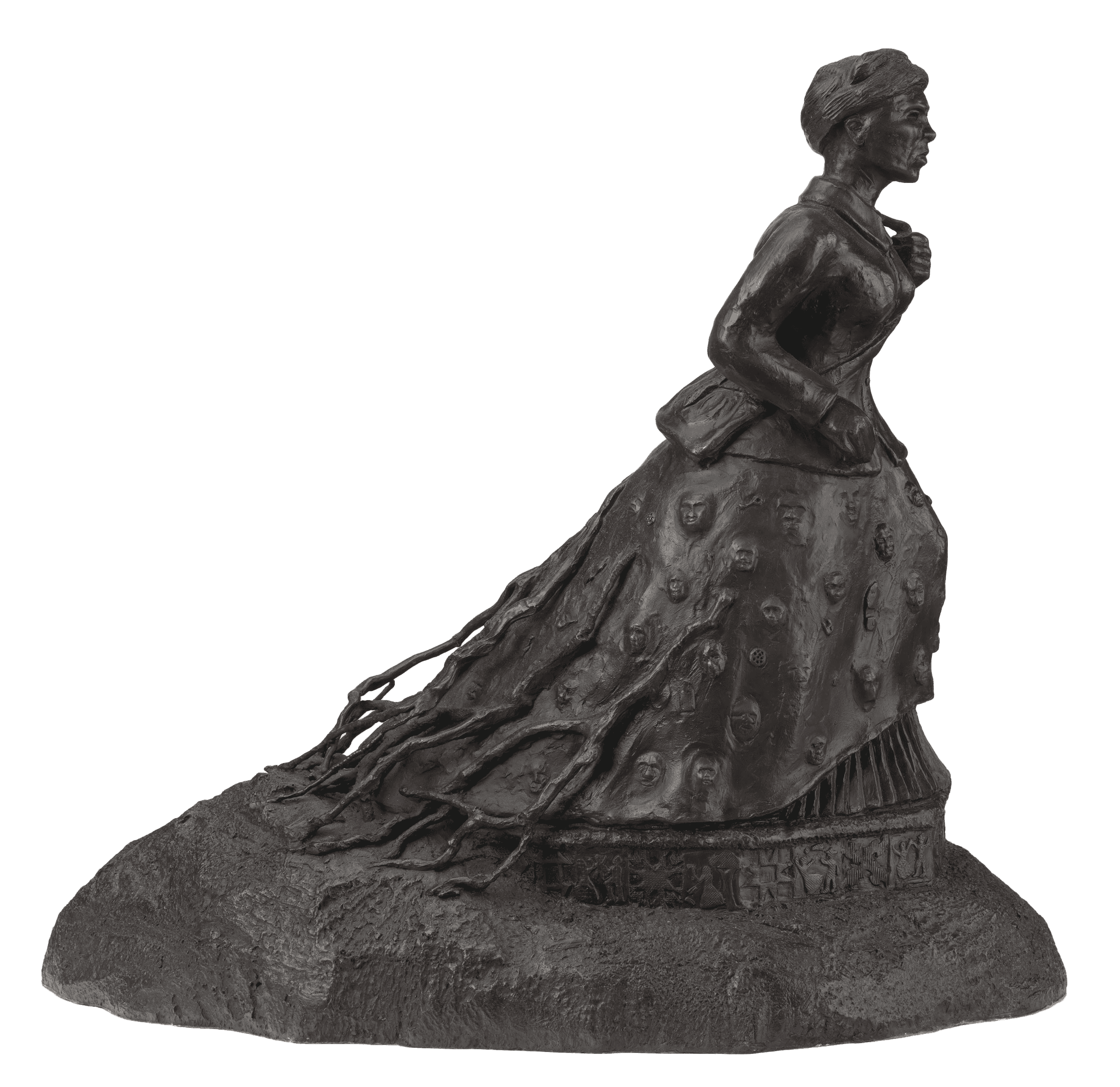 A bronze maquette of Harriet Tubman walking with roots trailing behind her. Faces, locks, and keys appear on her skirt.