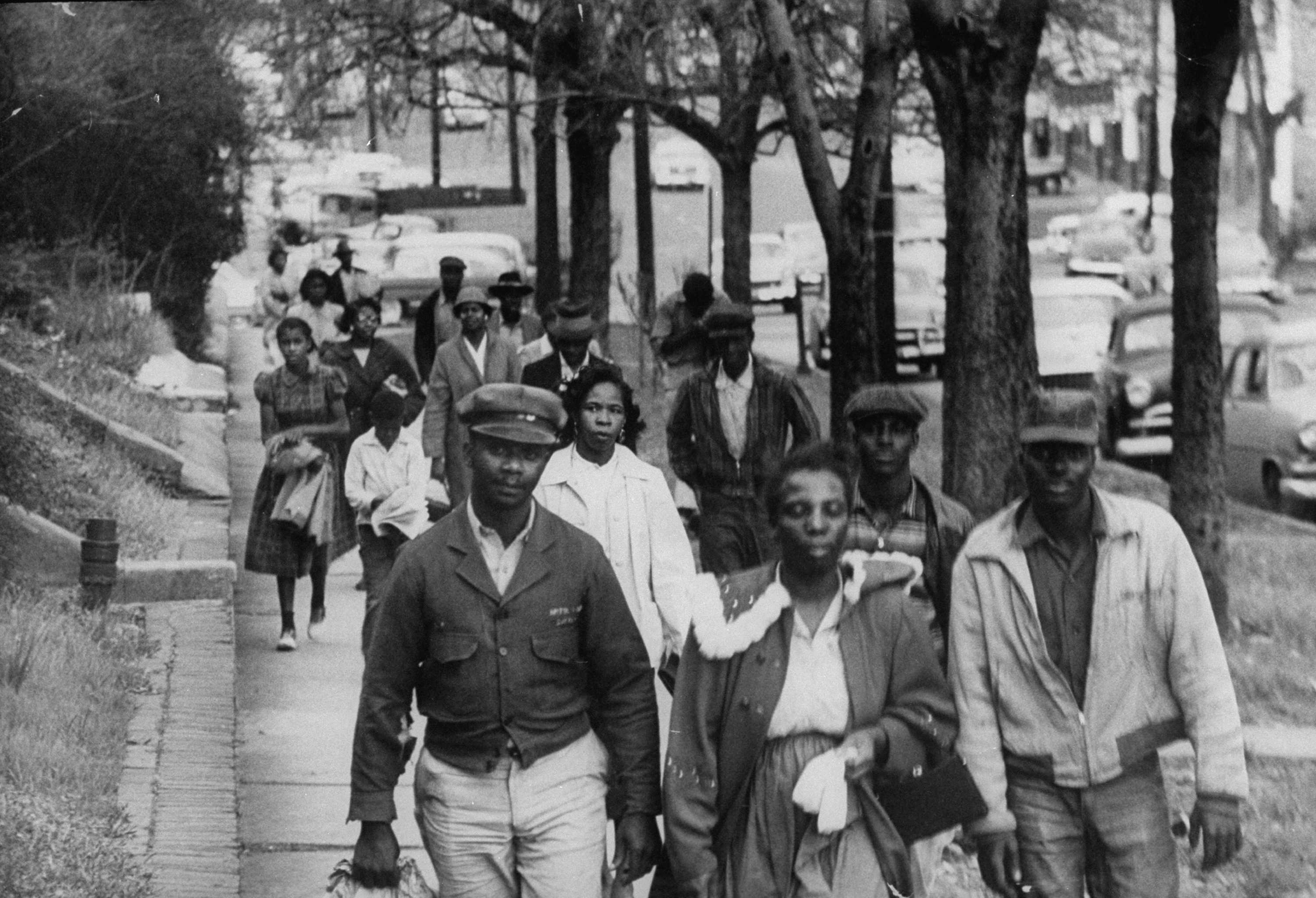 Black and white photograph of African Americas walking to work during the Montgomery busy boycott.