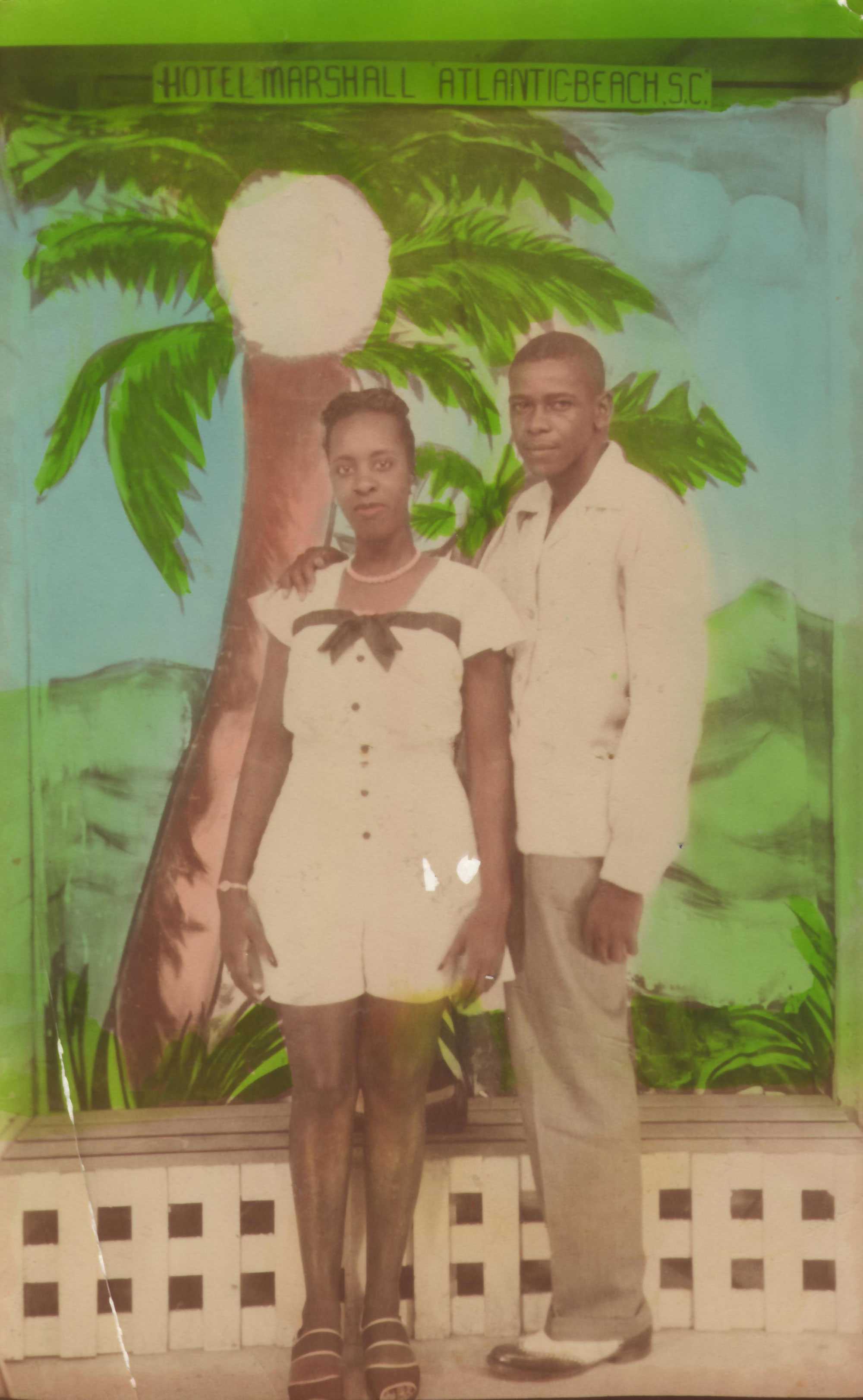 Colorized photograph of an African American couple posing before a tropical backdrop from "HOTEL MARSHALL ATLANTIC BEACH S.C."