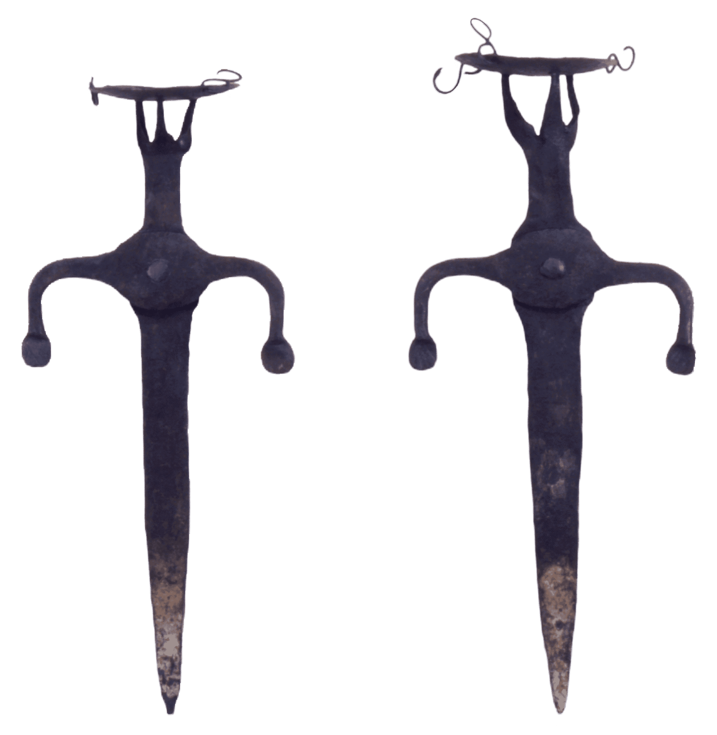 A pair of wrought iron splits with rusted tips and small pointed decorated top.